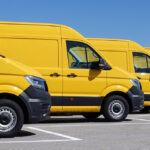 A row of yellow vans